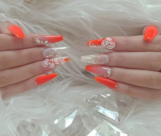 Orange Color Nail Art combined with glitter and 3D Flower